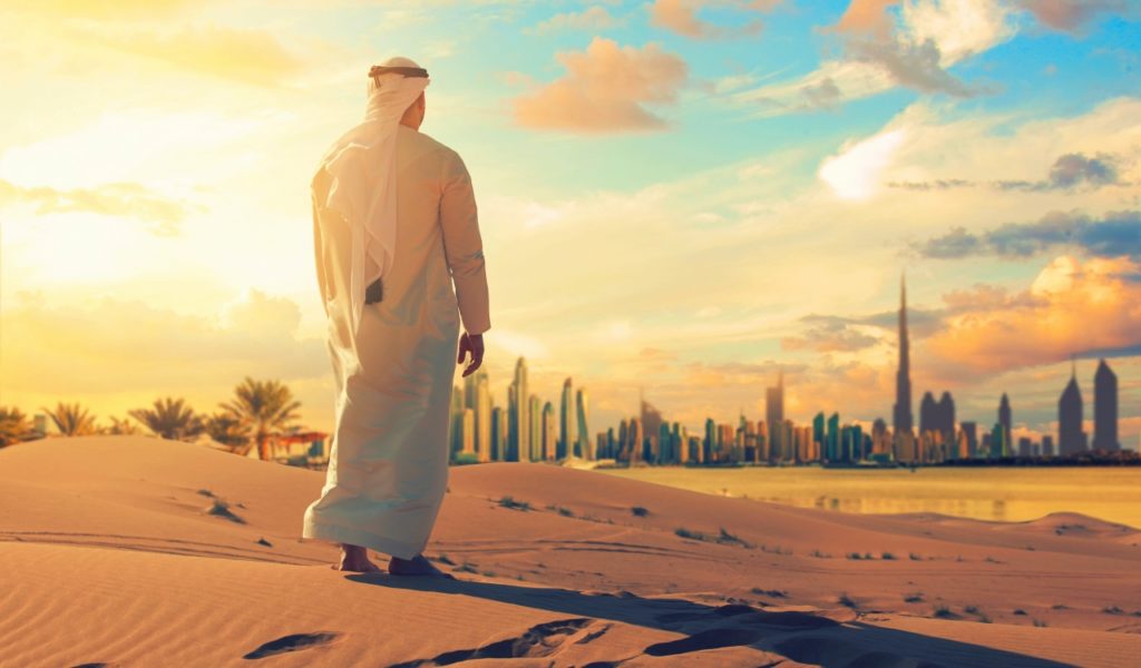 Middle Eastern Man Outside City In Desert