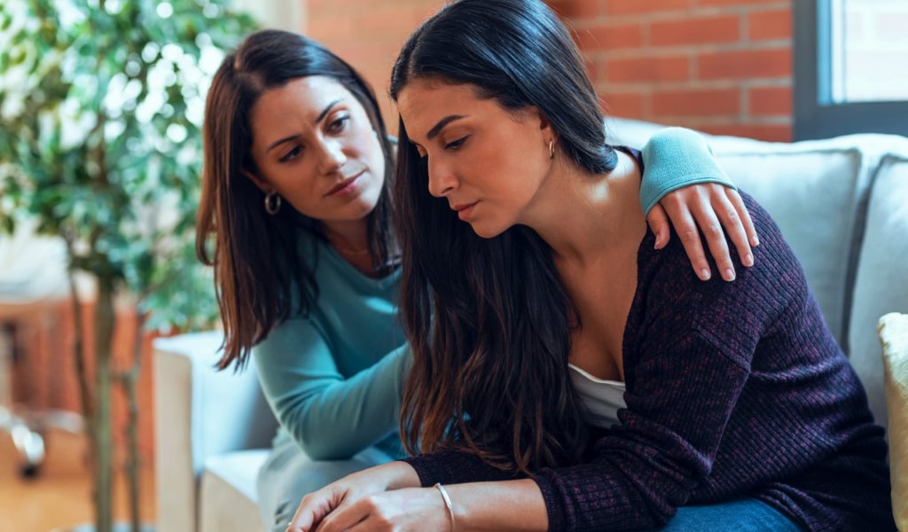 Woman Supporting Another Woman