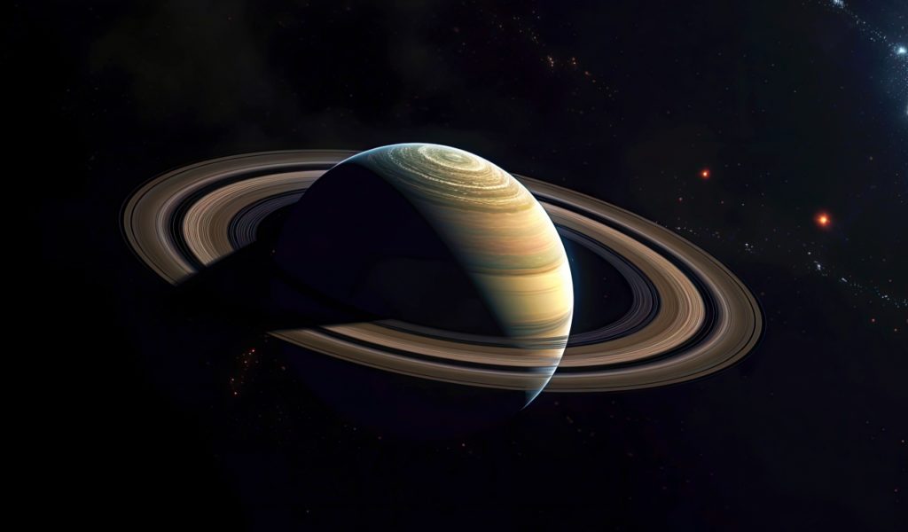 Saturn With Partial Light From The Sun